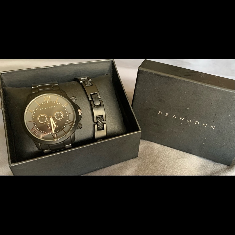 Brand new- never worn. Beautiful Mens watch with 2 bands. Original packaging.